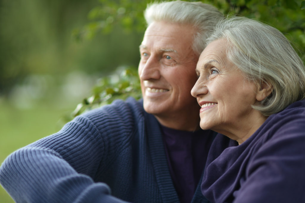Retirement aged couple smiling